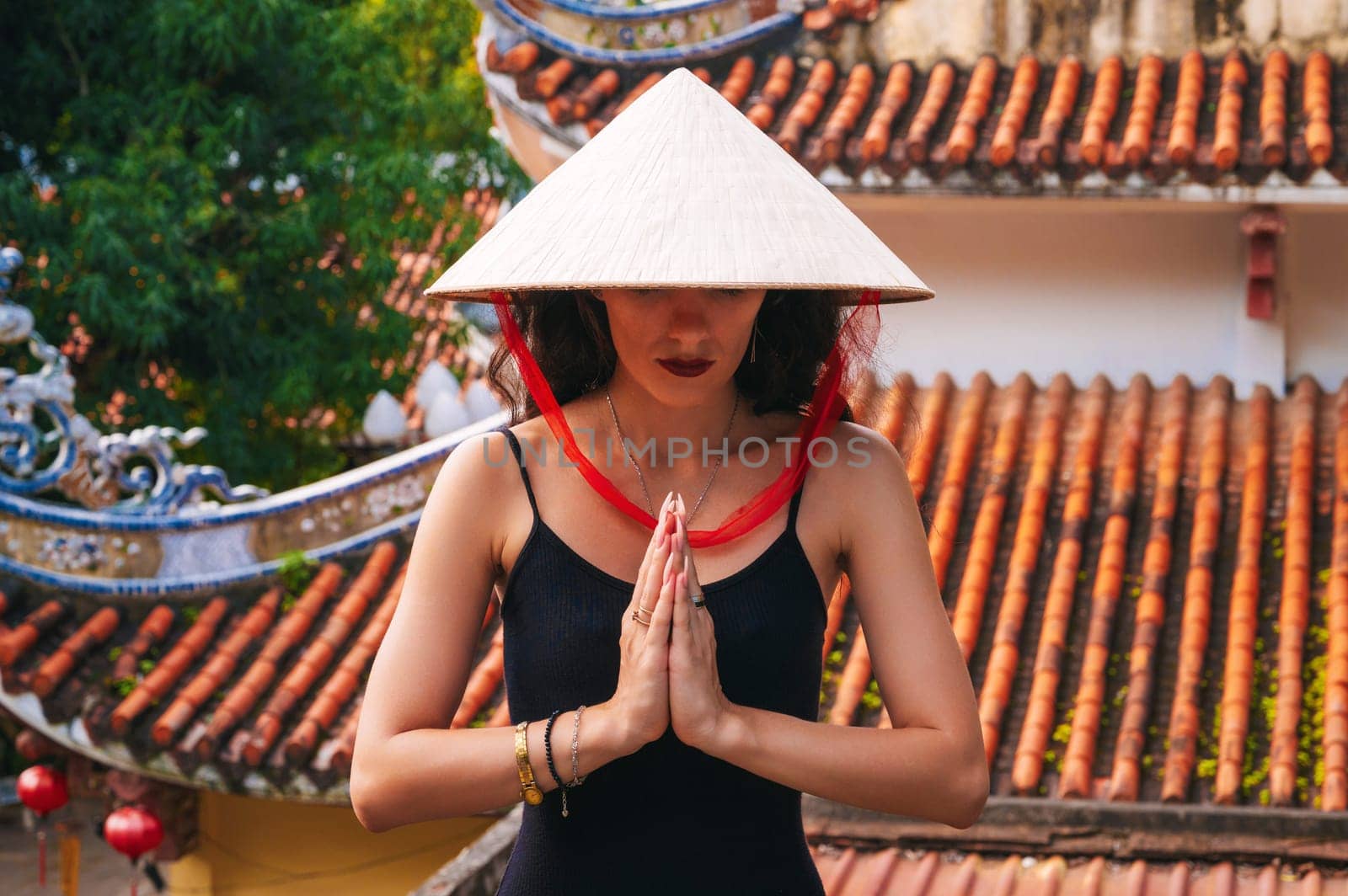 portrait of a woman tourist traveler at the temple on the Buddhist pagoda in Vietnam. Travel and tourism in Asia