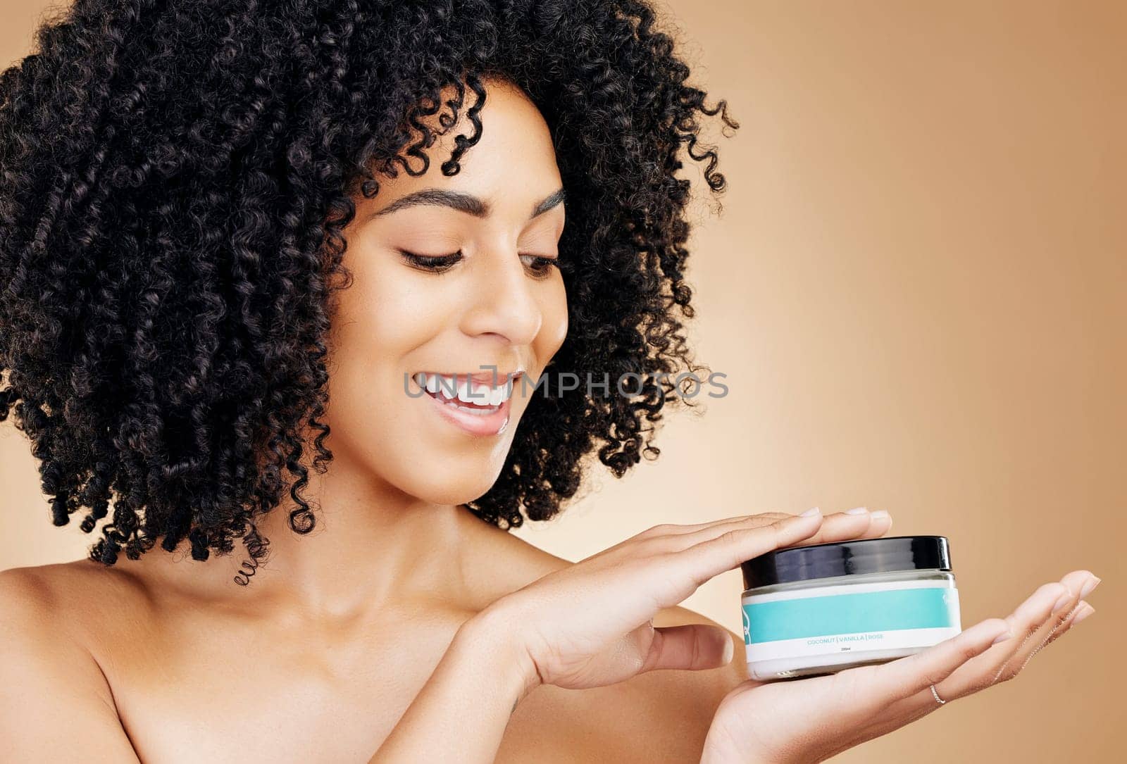 Woman, container and hair, product for curls and shine, beauty with smile and strong texture on studio background. Advertising, haircare cosmetics for growth and cosmetology with model and afro by YuriArcurs