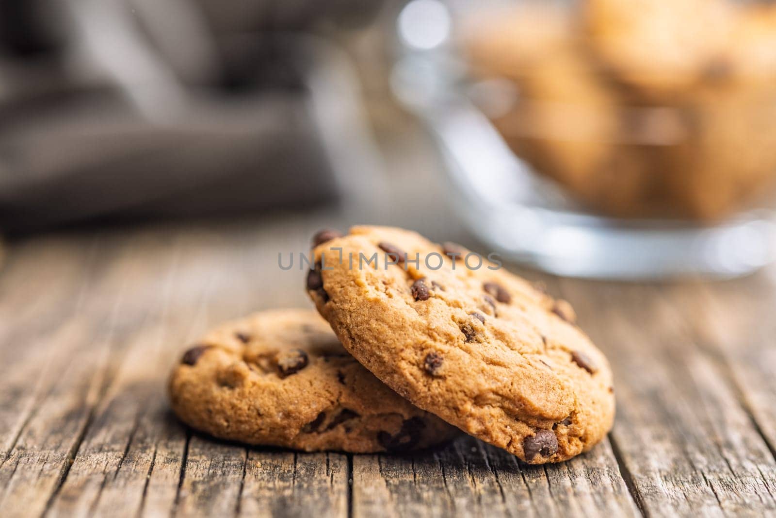 Chocolate chip cookies on a wooden table.