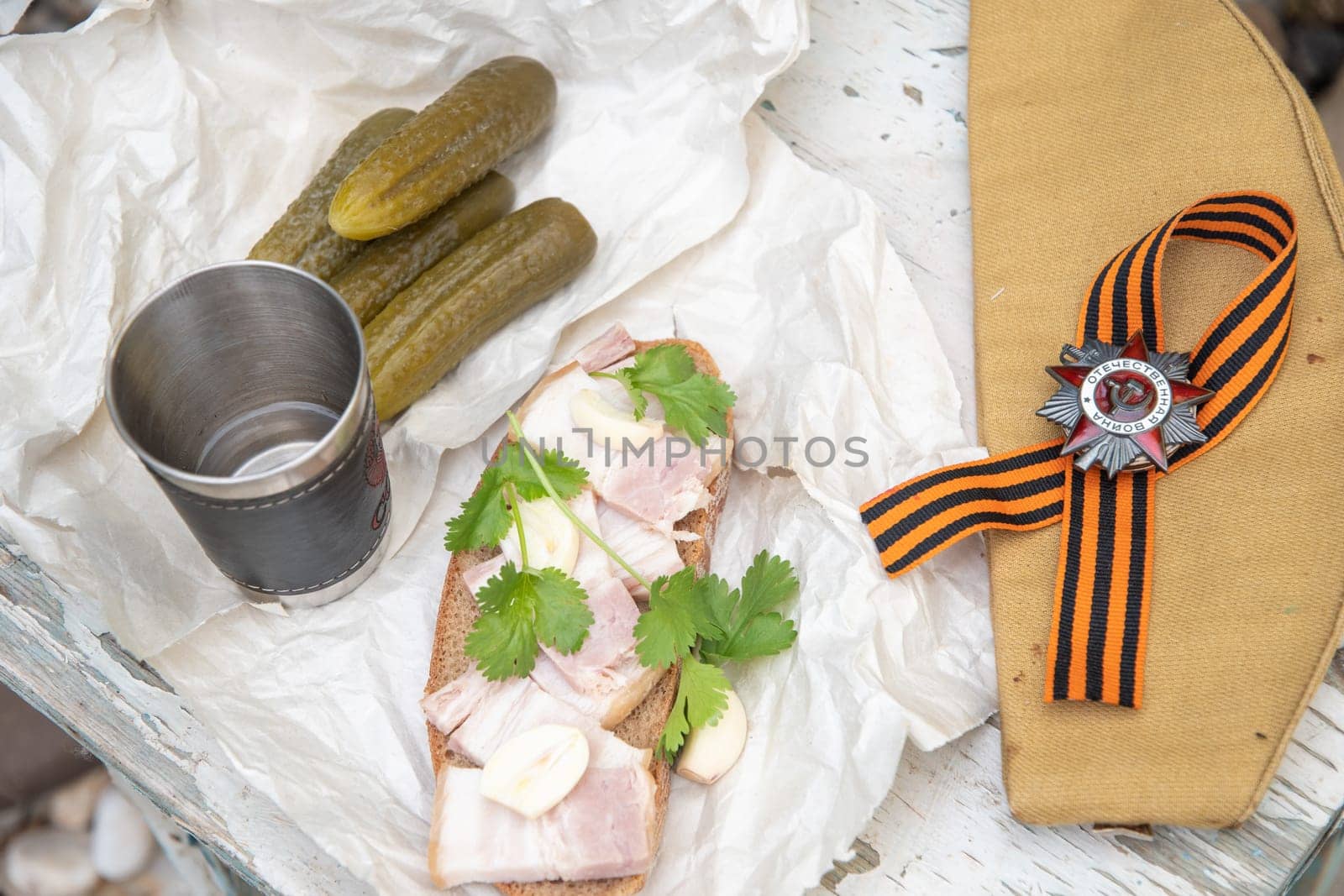 shot of vodka and snack of lard and pickled cucumber,Russians celebrate February 23,Defender of Fatherland Day,May 9,Victory Day,grandfather's awards,St.George ribbon,Order of the Great Patriotic War,