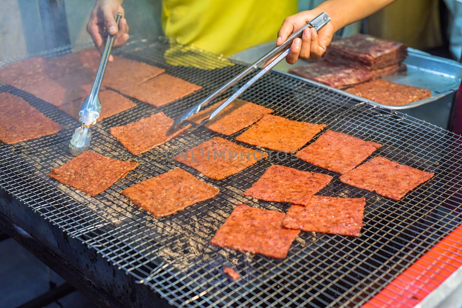 Bbq slice meat pork in the street food Jalan Alor in Kuala Lumpur