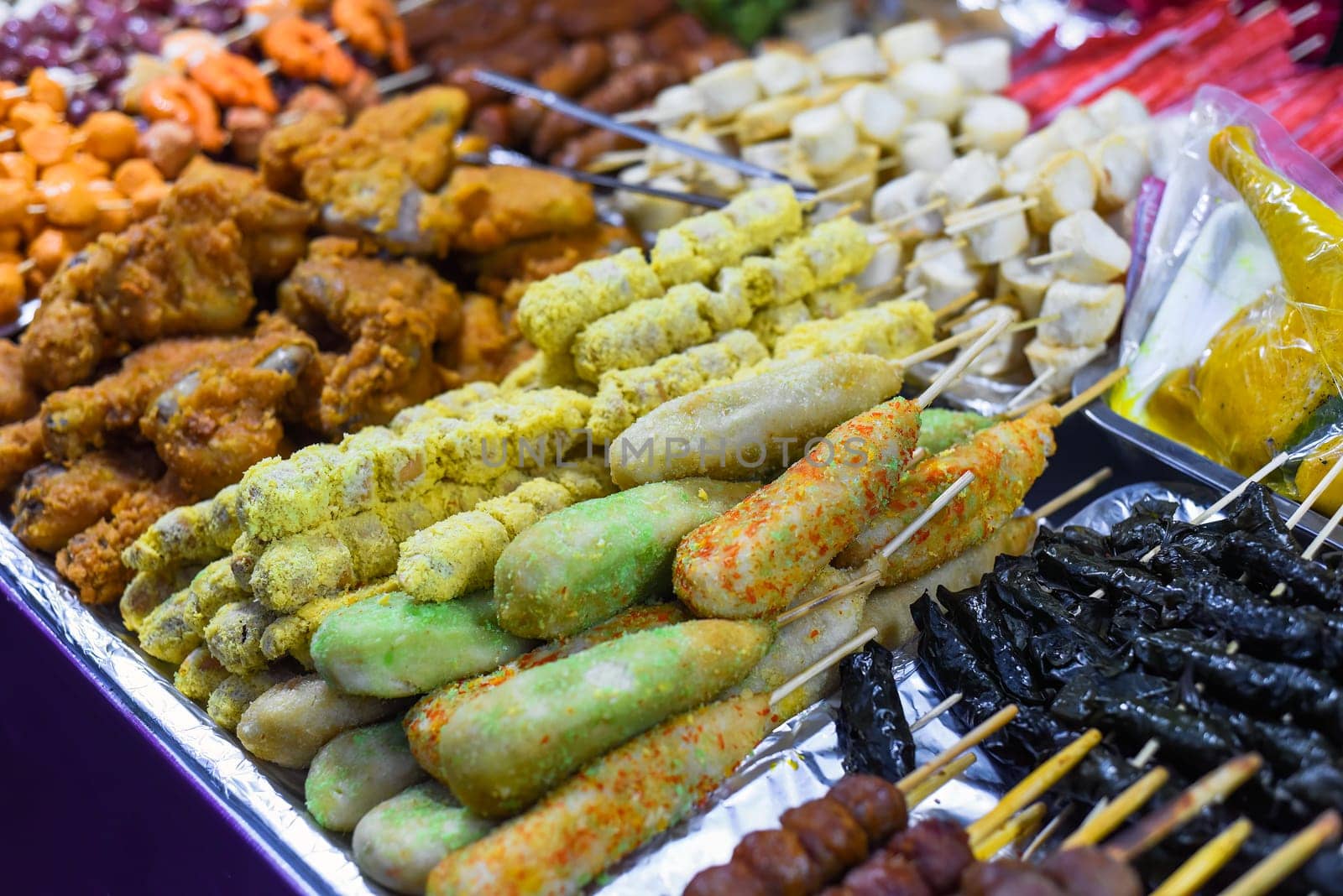 Many snacks and seafood in vietnamese night market in food festival