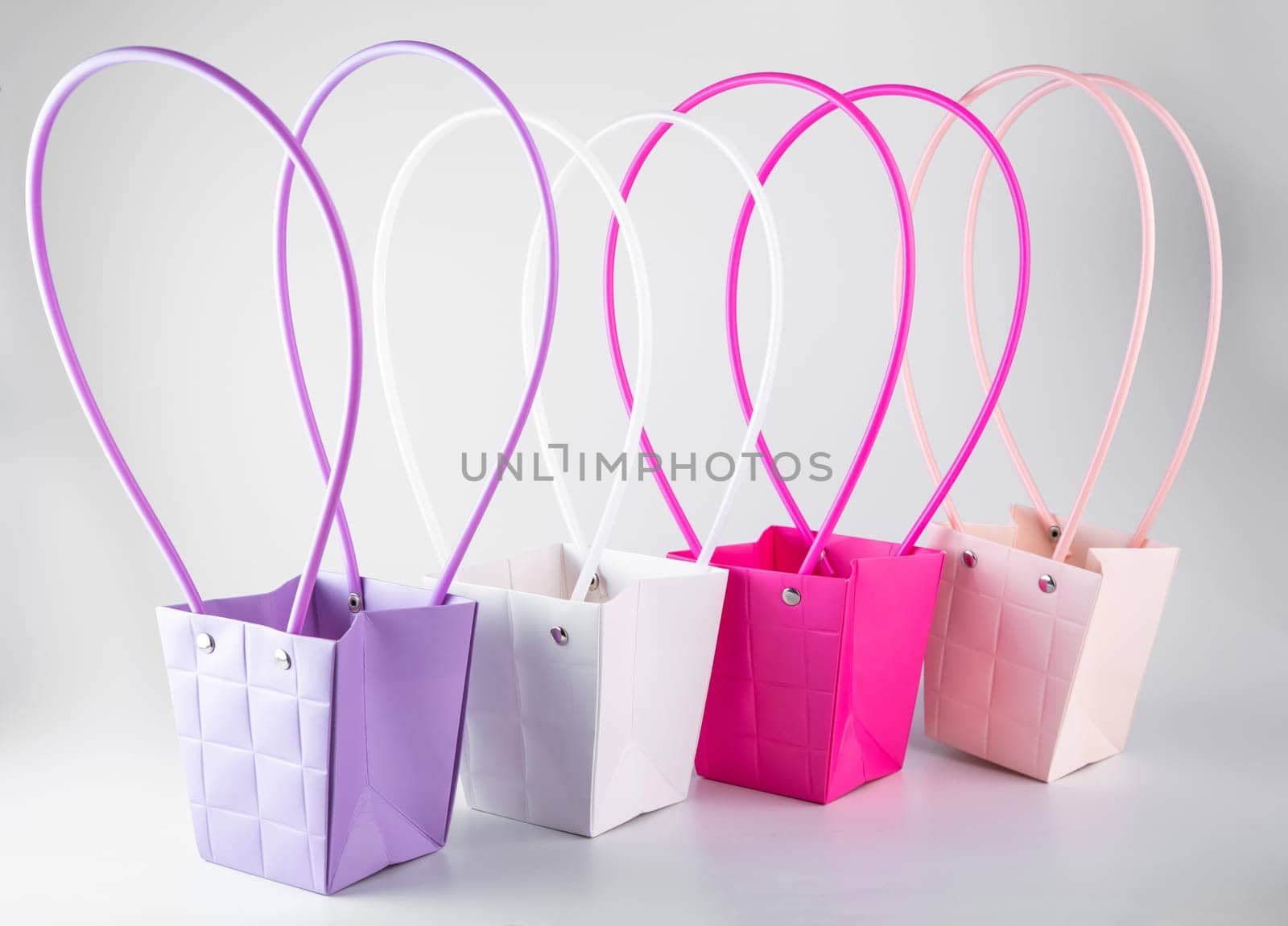 Plym package bags for flowers made of corrugated cardboard on white background