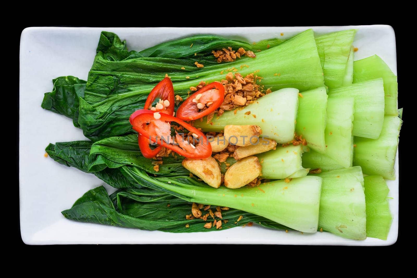 Vietnamese stir fried cabbage with garlic isolated on black background for a menu