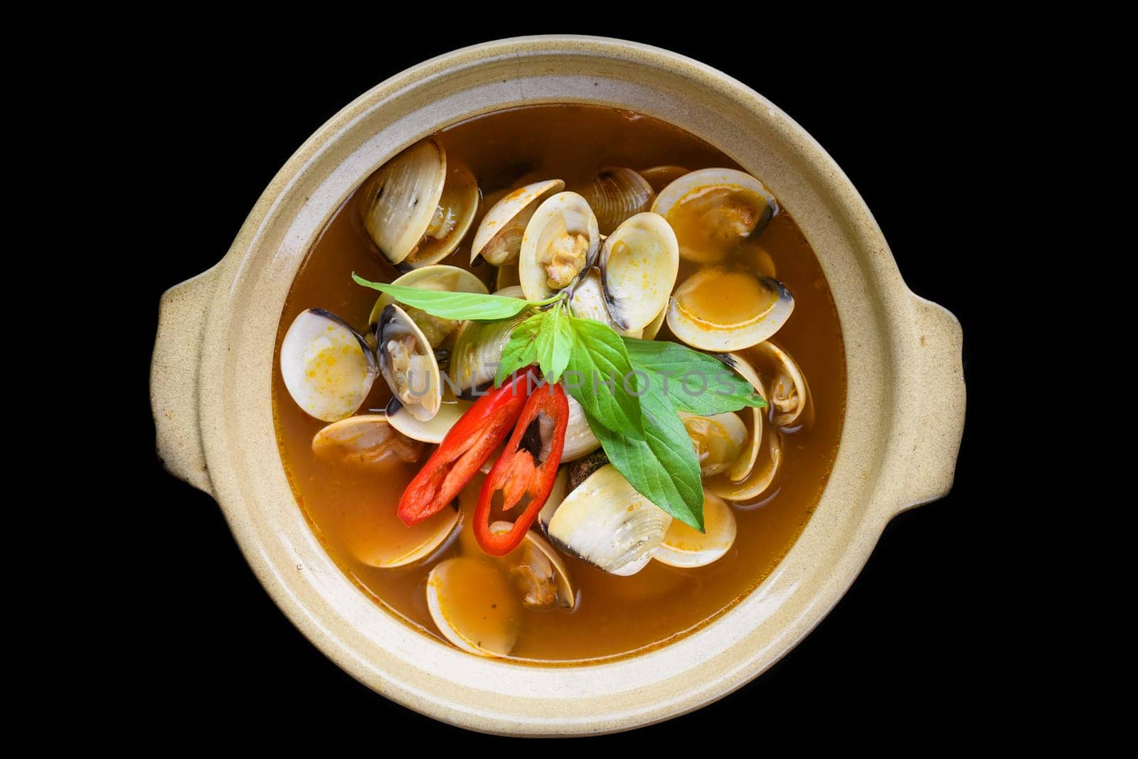 Steamed clams or clam soup cooked in vietnamese style isolated on black background top view