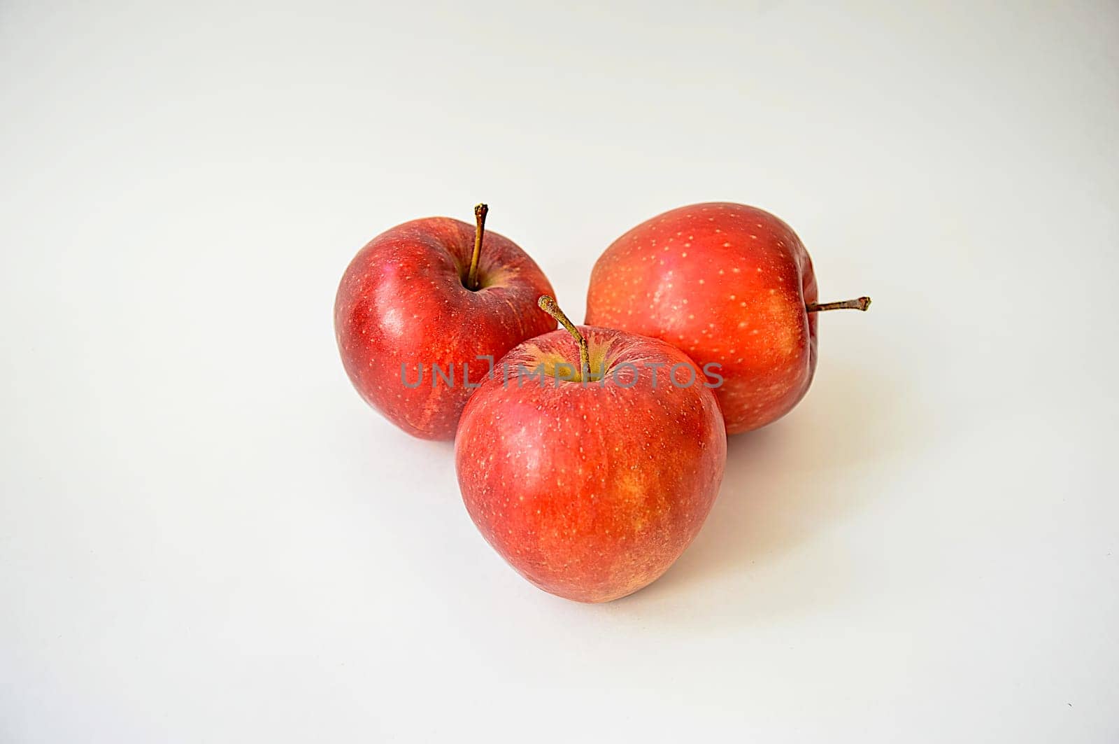 Large appetizing red apples isolated on white background