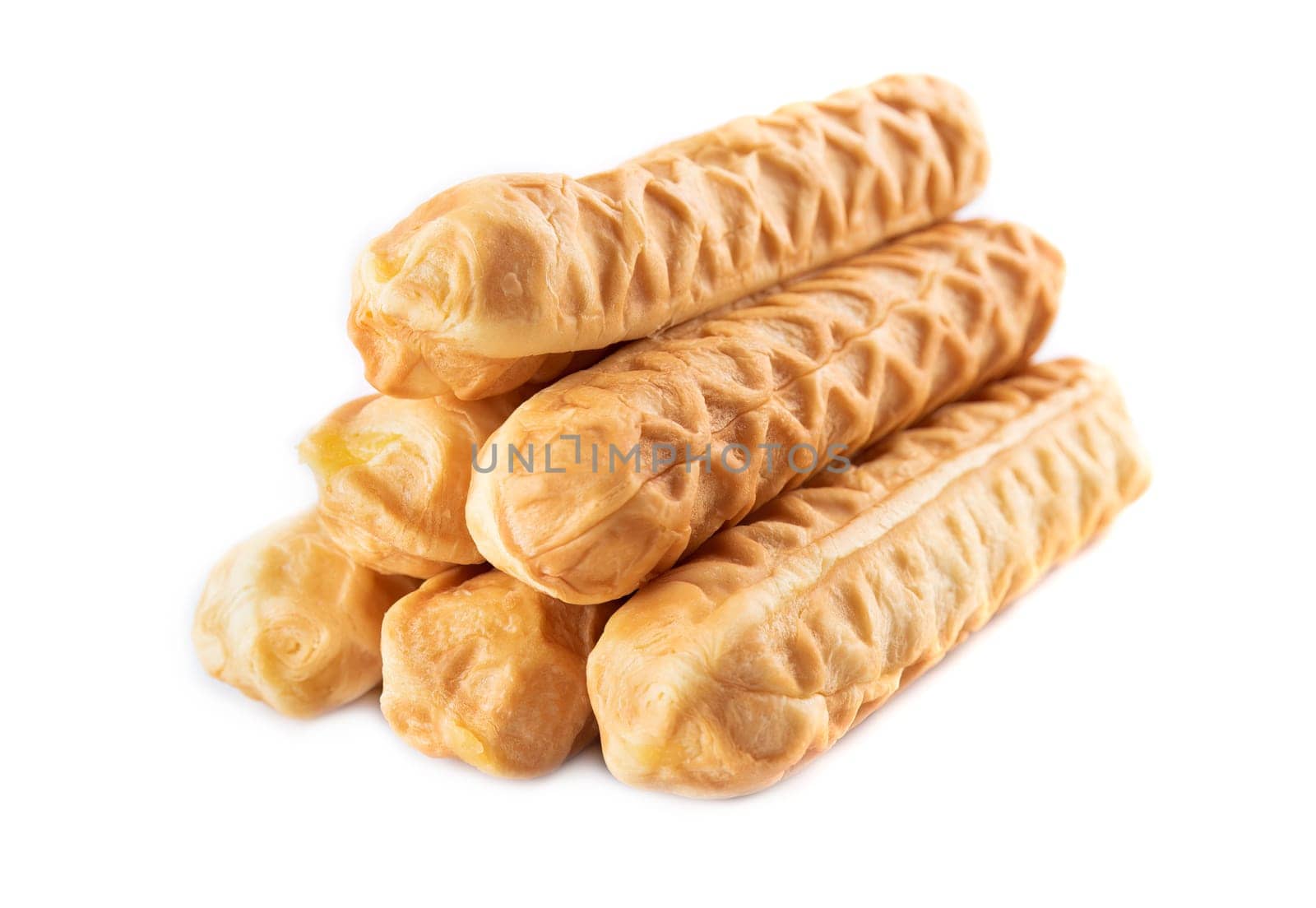 Pile of asian breadsticks with cheese flavor isolated on white background