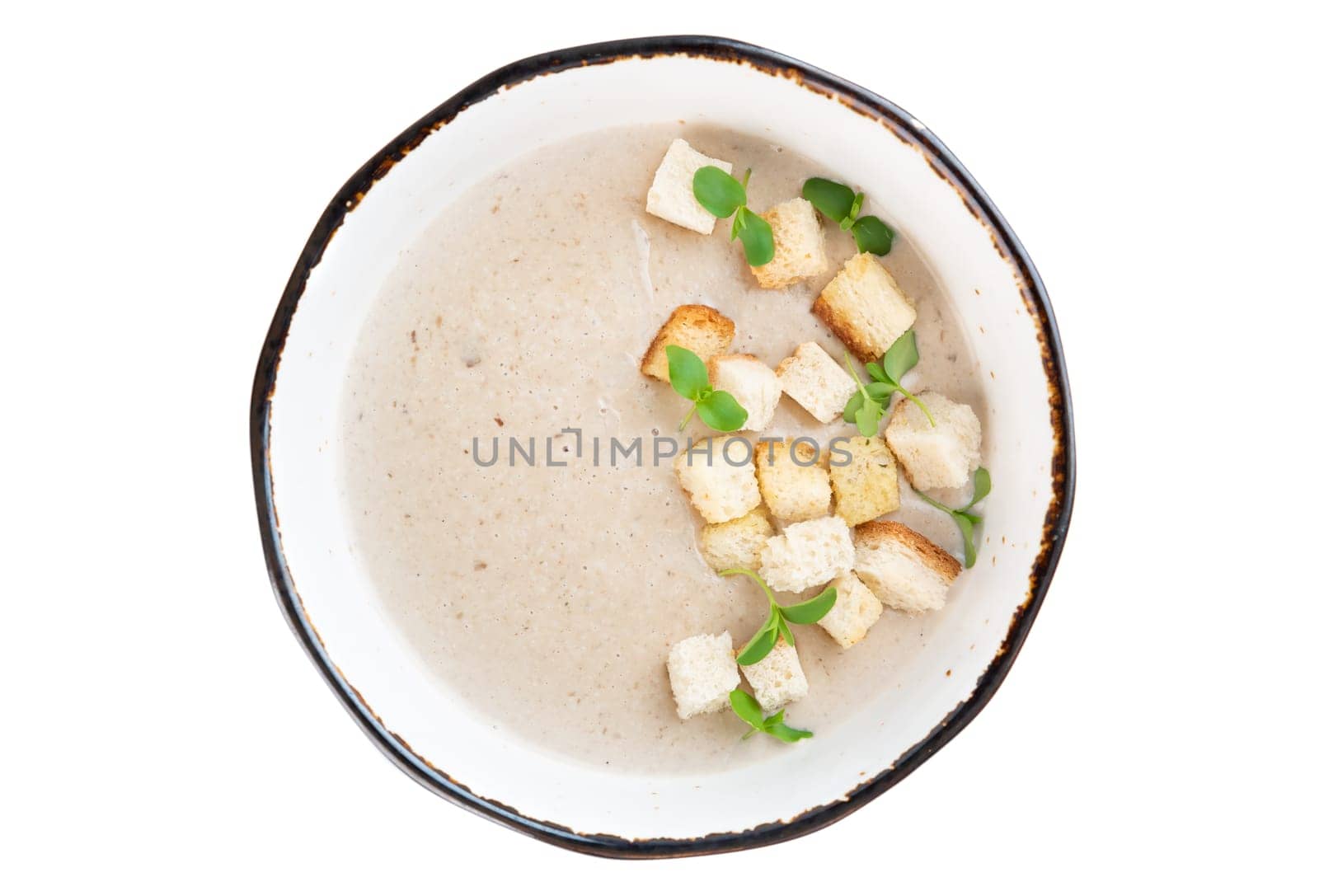 Mushrooms Soup with crackers isolated on white background top view