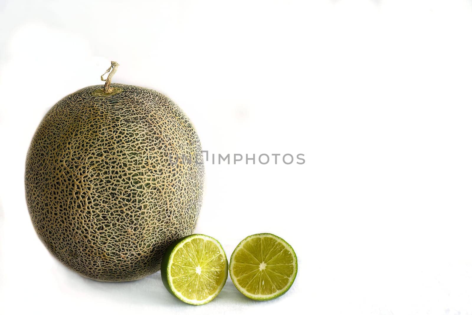 melon fruit and lime on white background