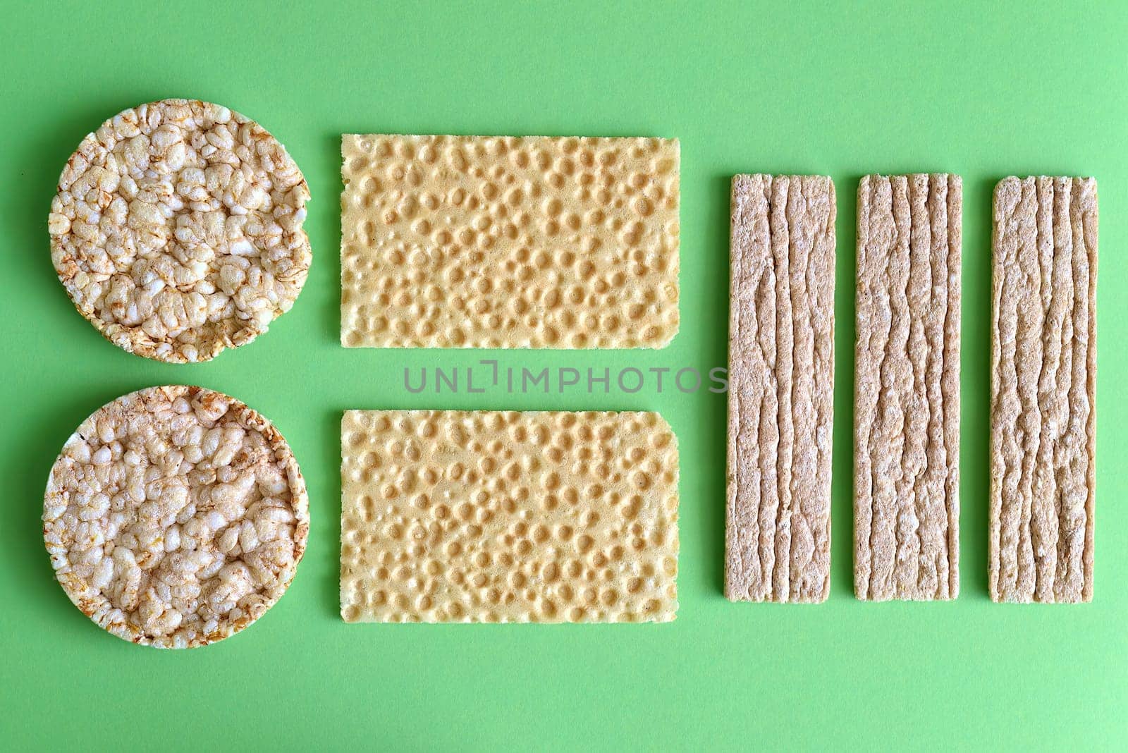 Types of diet whole grain crisps on a green background