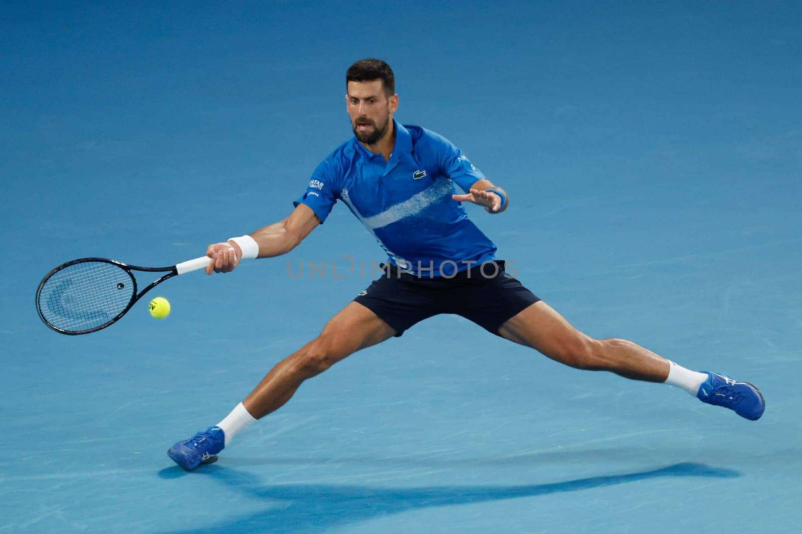 MELBOURNE, AUSTRALIA - JANUARY 19: Novak Djokovic of Serbia hits a forehand whilst playing Jiri Lehecka of Czech Republic on day eight of the 2025 Australian Open at Melbourne Park on January 19, 2025 in Melb