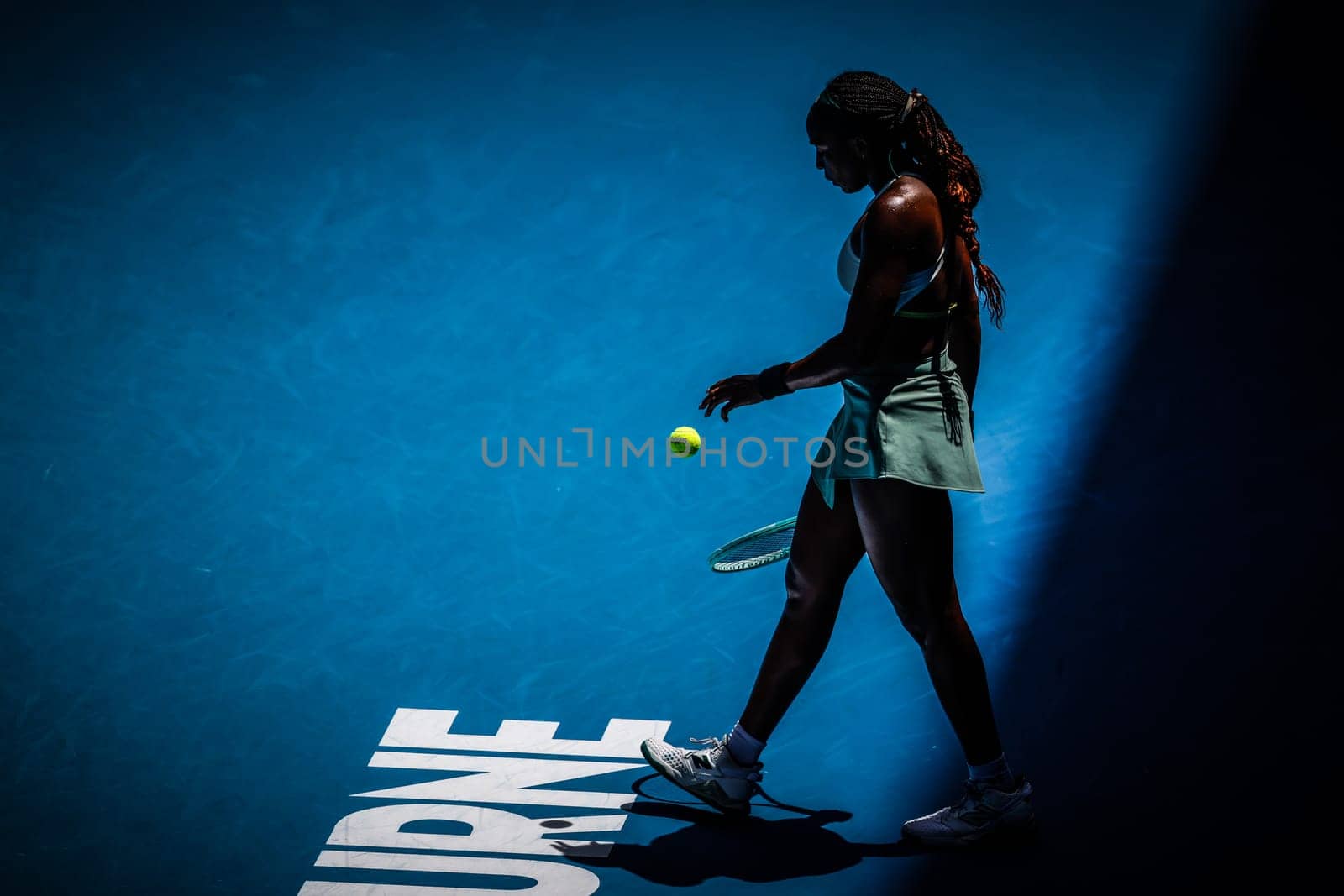 MELBOURNE, AUSTRALIA - JANUARY 19: Coco Gauff of USA serves to Belinda Bencic of Switzerland on day eight of the 2025 Australian Open at Melbourne Park on January 19, 2025 in Melbourne, Australia.