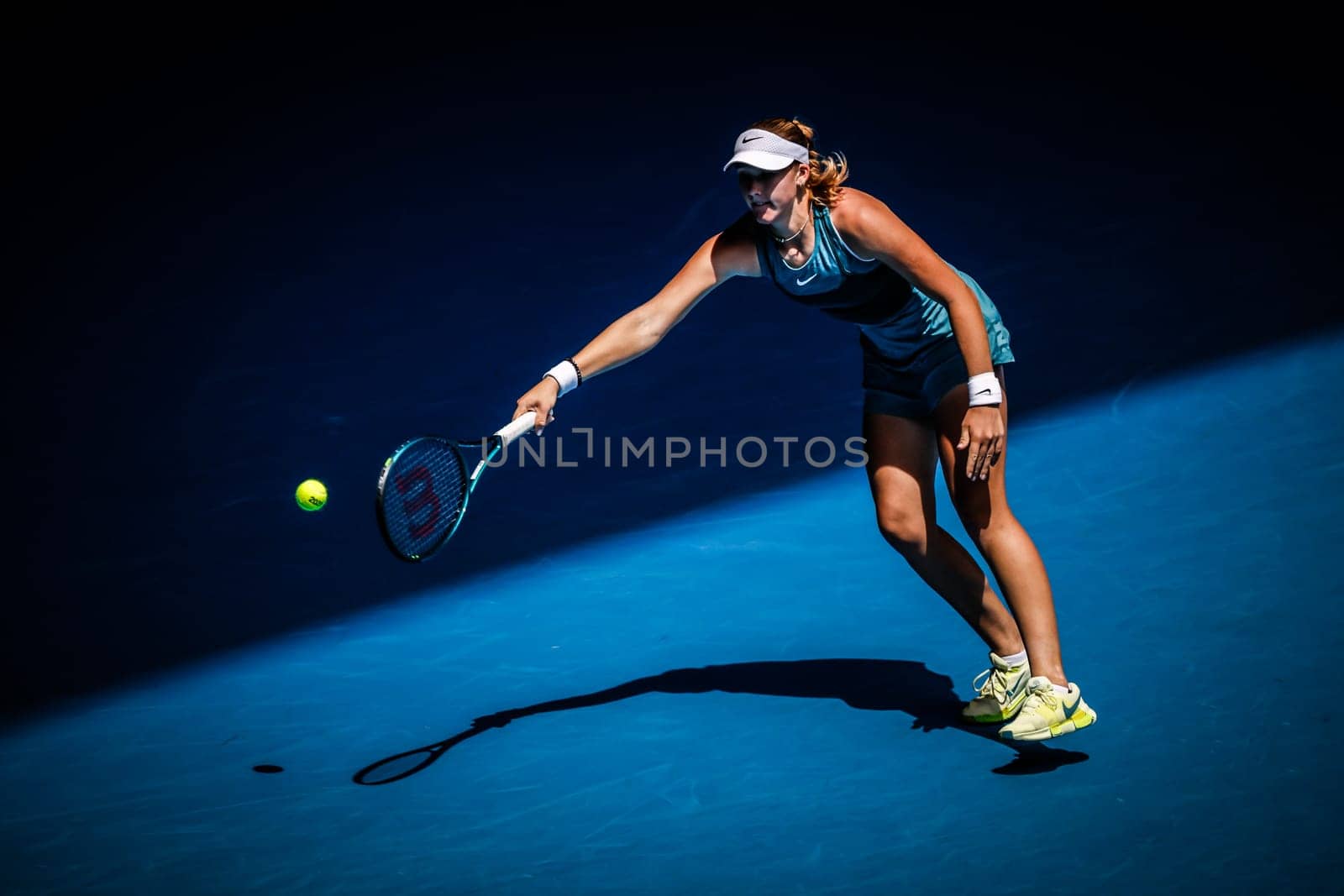 MELBOURNE, AUSTRALIA - JANUARY 19: Mirra Andreeva of Russia hits a forehand to Aryna Sabalenka of Belarus on day eight of the 2025 Australian Open at Melbourne Park on January 19, 2025 in Melbourne, Australia.