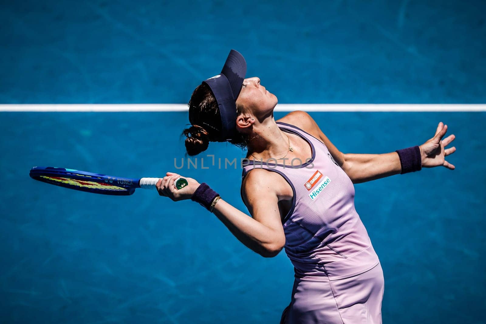 MELBOURNE, AUSTRALIA - JANUARY 19: Belinda Bencic of Switzerland serves to Coco Gauff of USA on day eight of the 2025 Australian Open at Melbourne Park on January 19, 2025 in Melbourne, Australia.