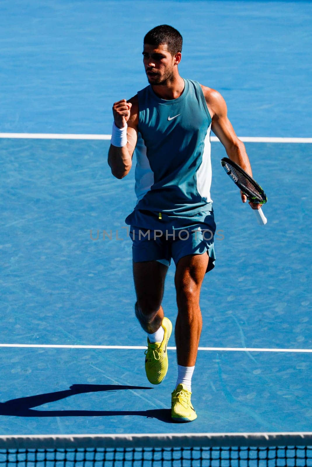 MELBOURNE, AUSTRALIA - JANUARY 19: Carlos Alcaraz of Spain reacts to winning a point against Jack Draper of Great Britain on day eight of the 2025 Australian Open at Melbourne Park on January 19, 2025 in Melbourne, Australia.