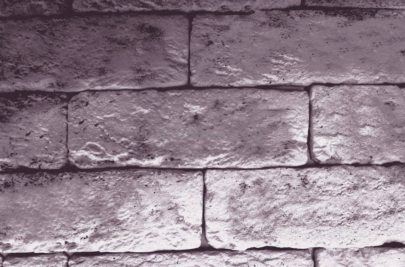 An old monochrome wall of blocks in close-up
