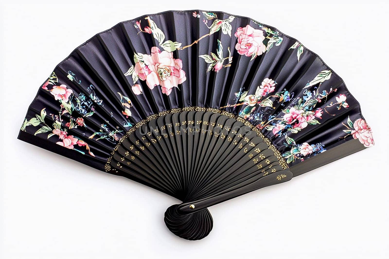 A beautifully crafted hand fan showcases intricate floral patterns, resting on a neutral background.