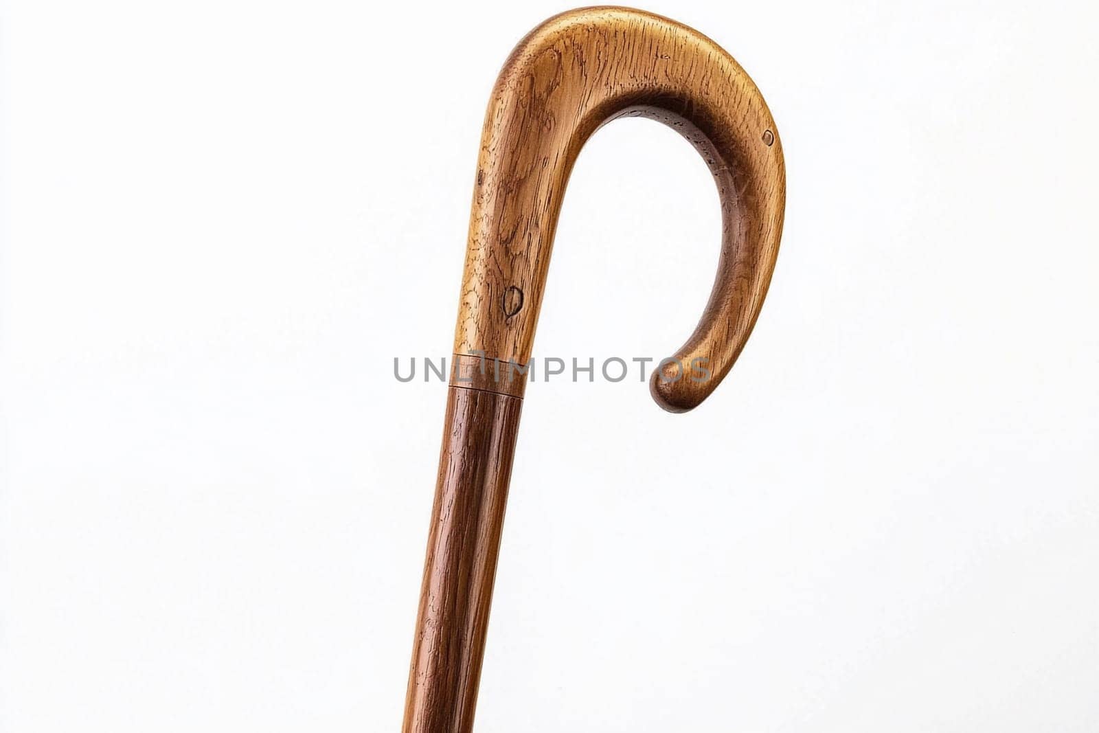 A beautifully crafted wooden cane showcases its unique curved handle and smooth finish.