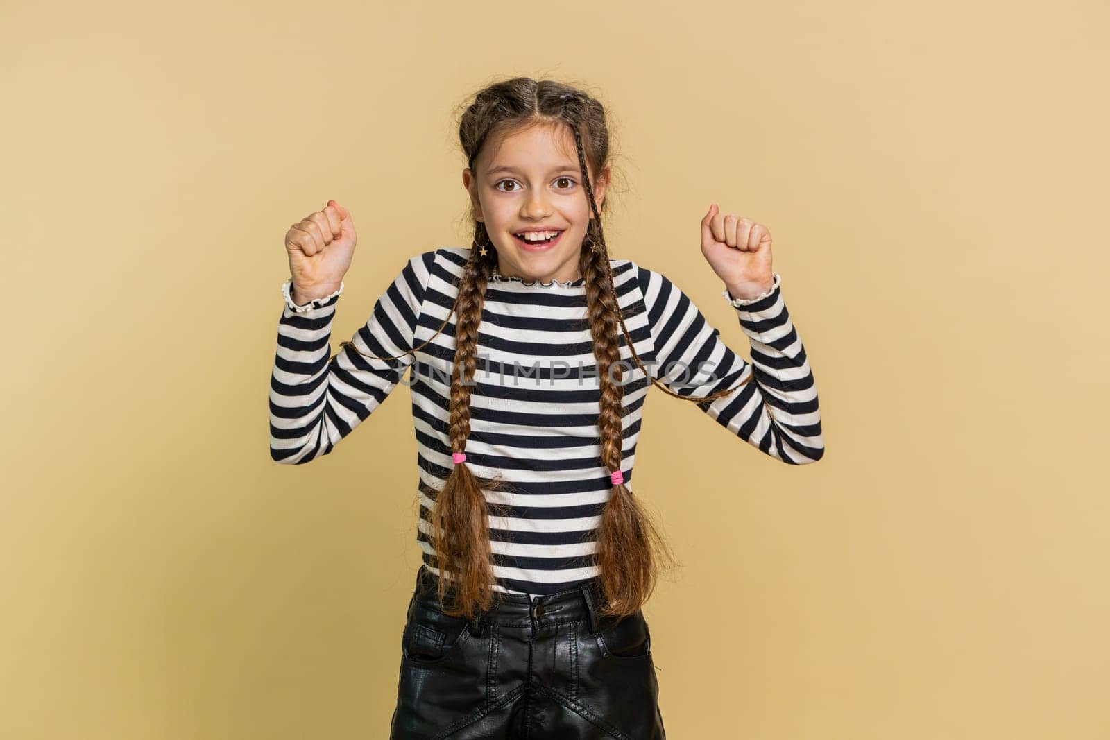 Young preteen child girl kid feeling hopelessness and loneliness, nervous breakdown, loses becoming surprised by game fail, bad fortune, loss, unlucky news. Teenager children on beige background