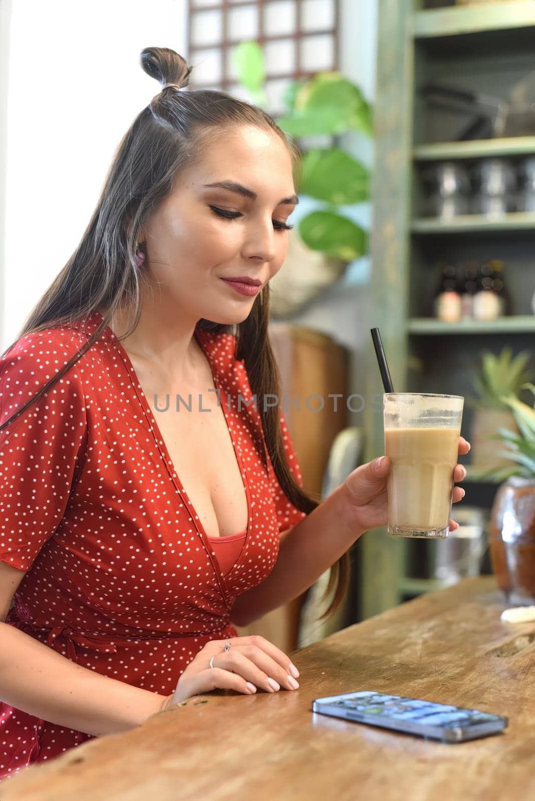 Young woman surfing the internet in the cafe