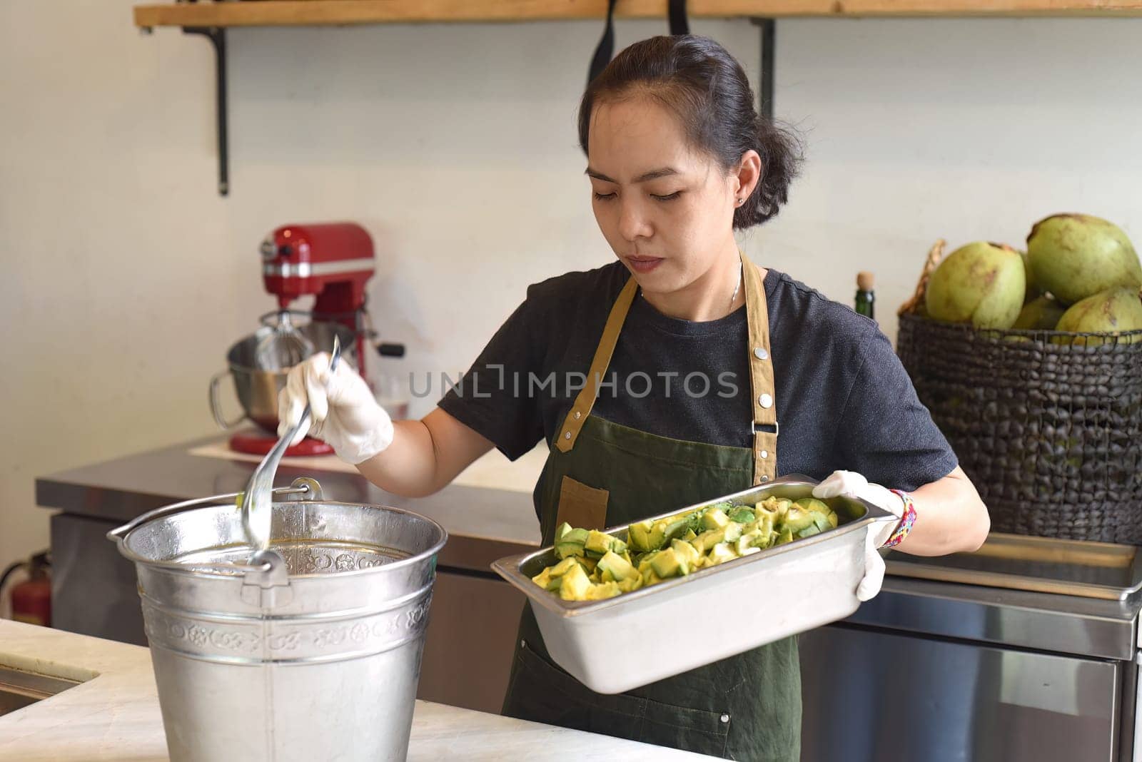 Vietnamese woman making avocado homemade ice cream
