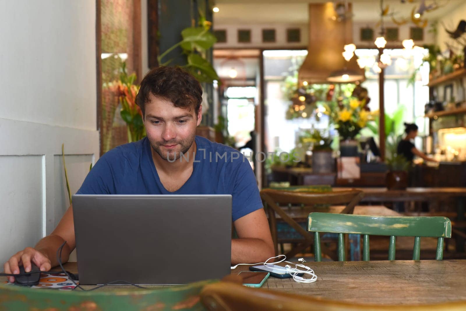 Young freelancer working in a cafe
