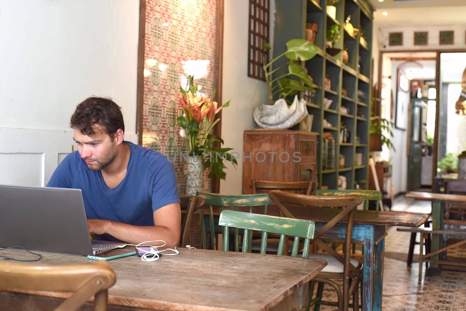 Young freelancer working in a cafe