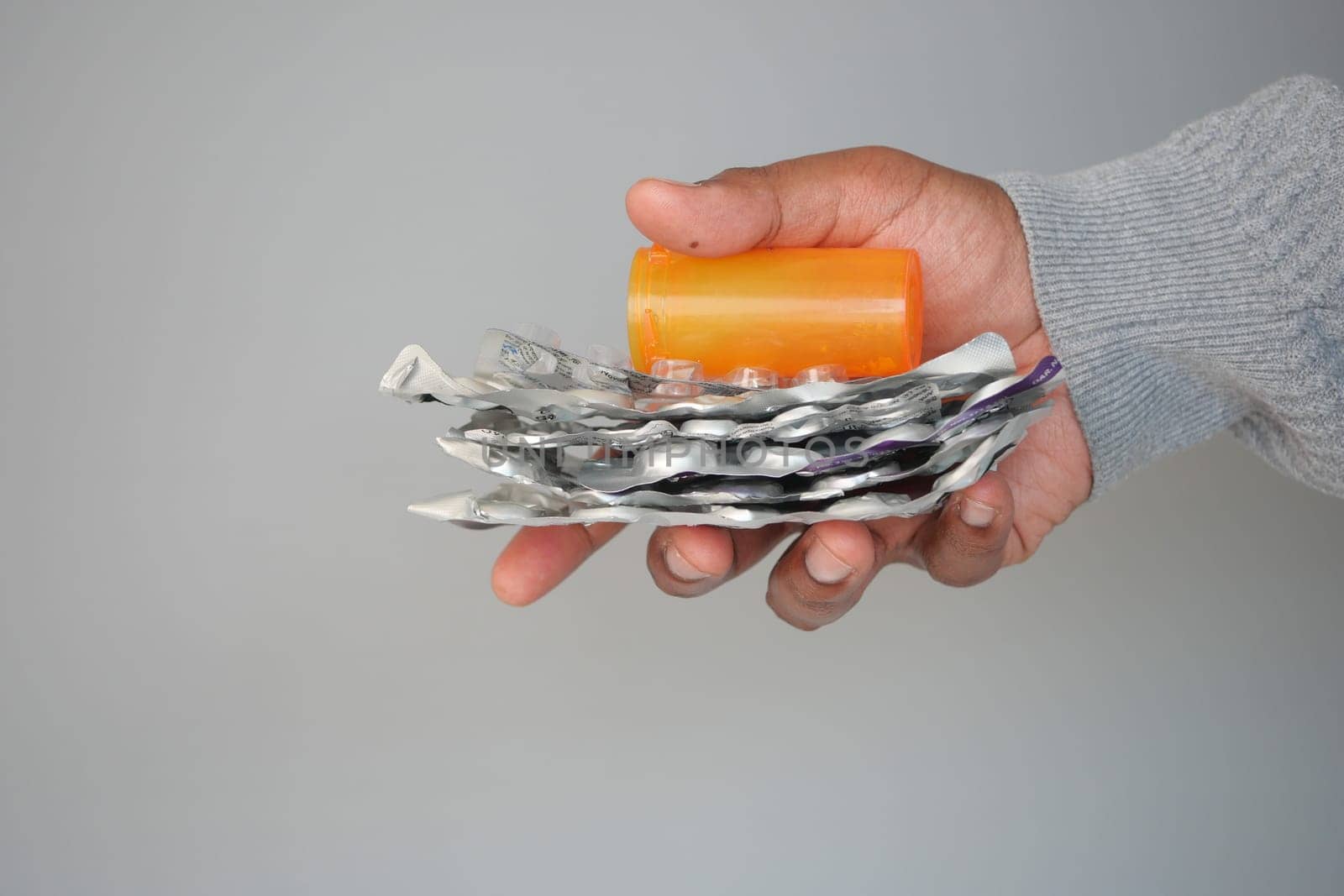 hand holding a empty pills of blister pack .
