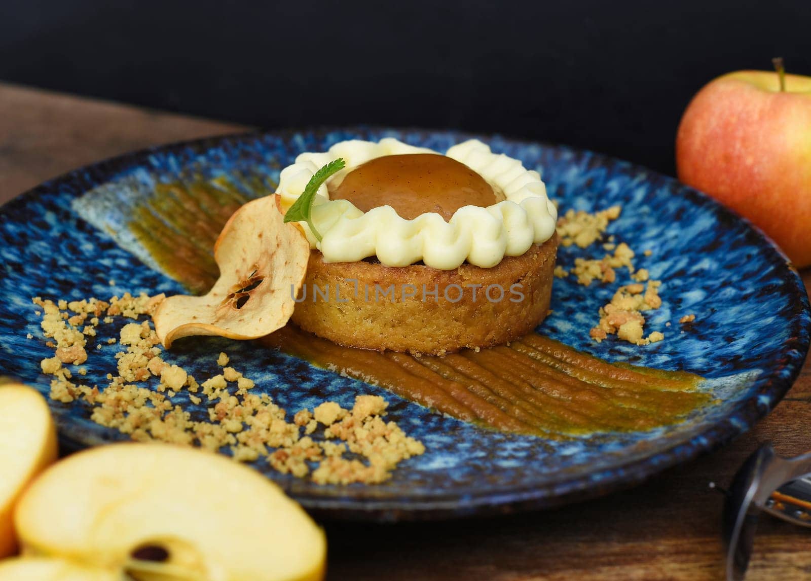 Apple tart with fresh apples on wooden table