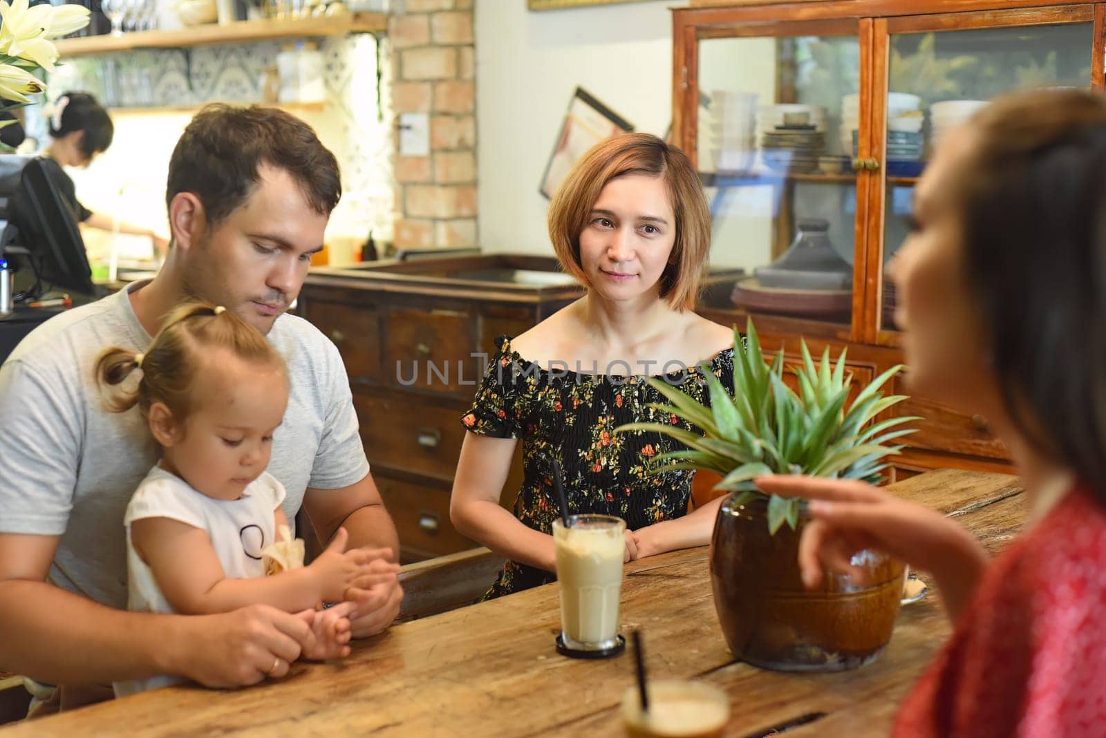Young people communicate with each other in cafe