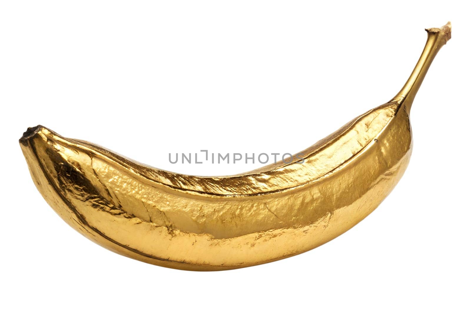 A creatively designed banana covered in gold, showcasing an artistic interpretation. This unique object represents a blend of nature and luxury with a surreal touch.