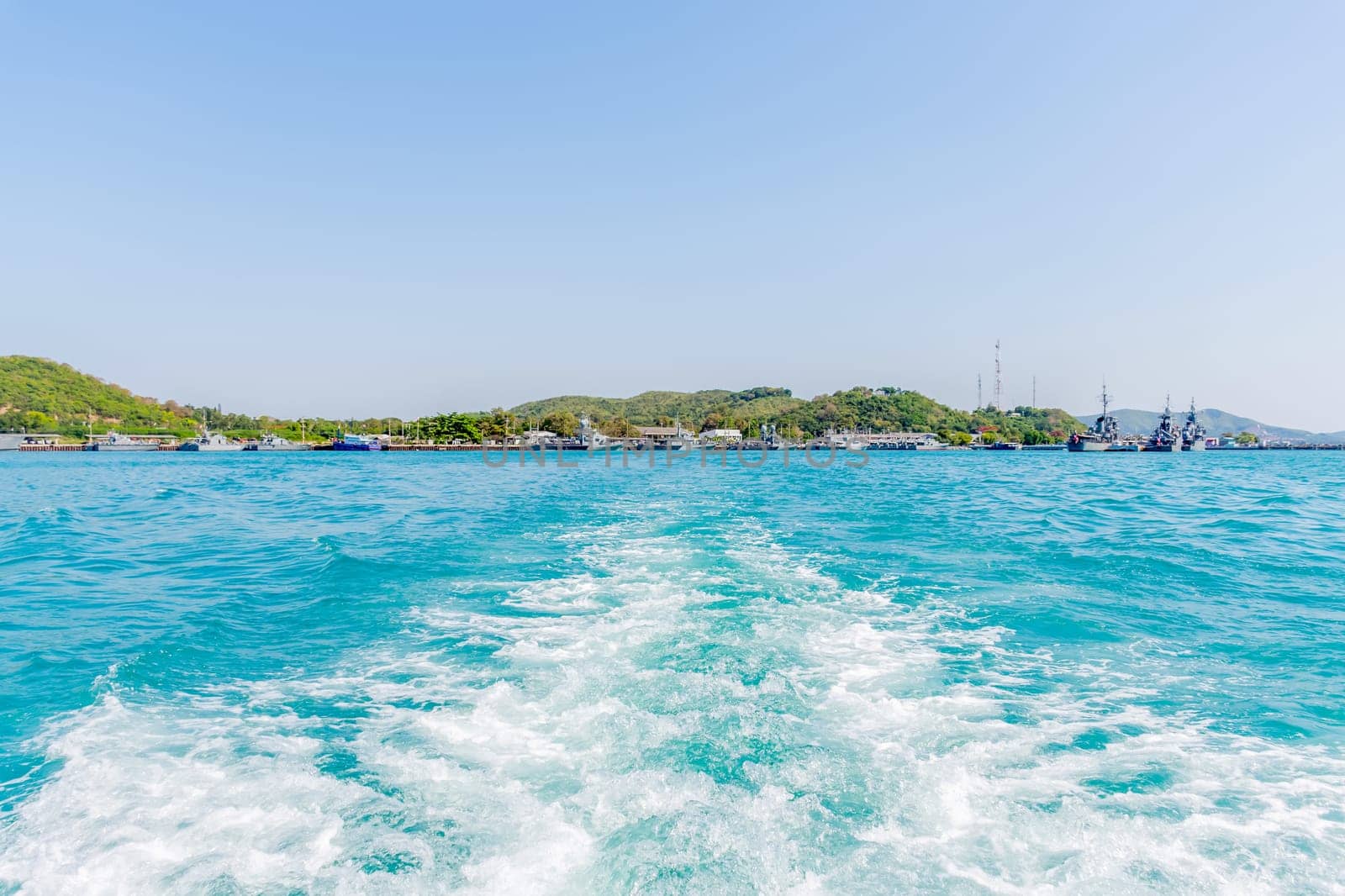 Tourist by sailing on turquoise ocean by ship with sun light in day time when vacation travel at sea for relax