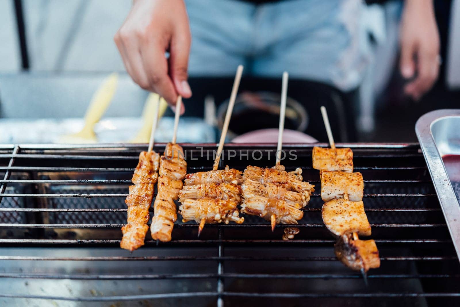 Mala is Grilled meat (Beef, Pork, Chickens or Mushroom) with chilli sauce and chinese hot spicy herb (Sichuan Pepper) for sale at Thai street food market or restaurant in Bangkok Thailand