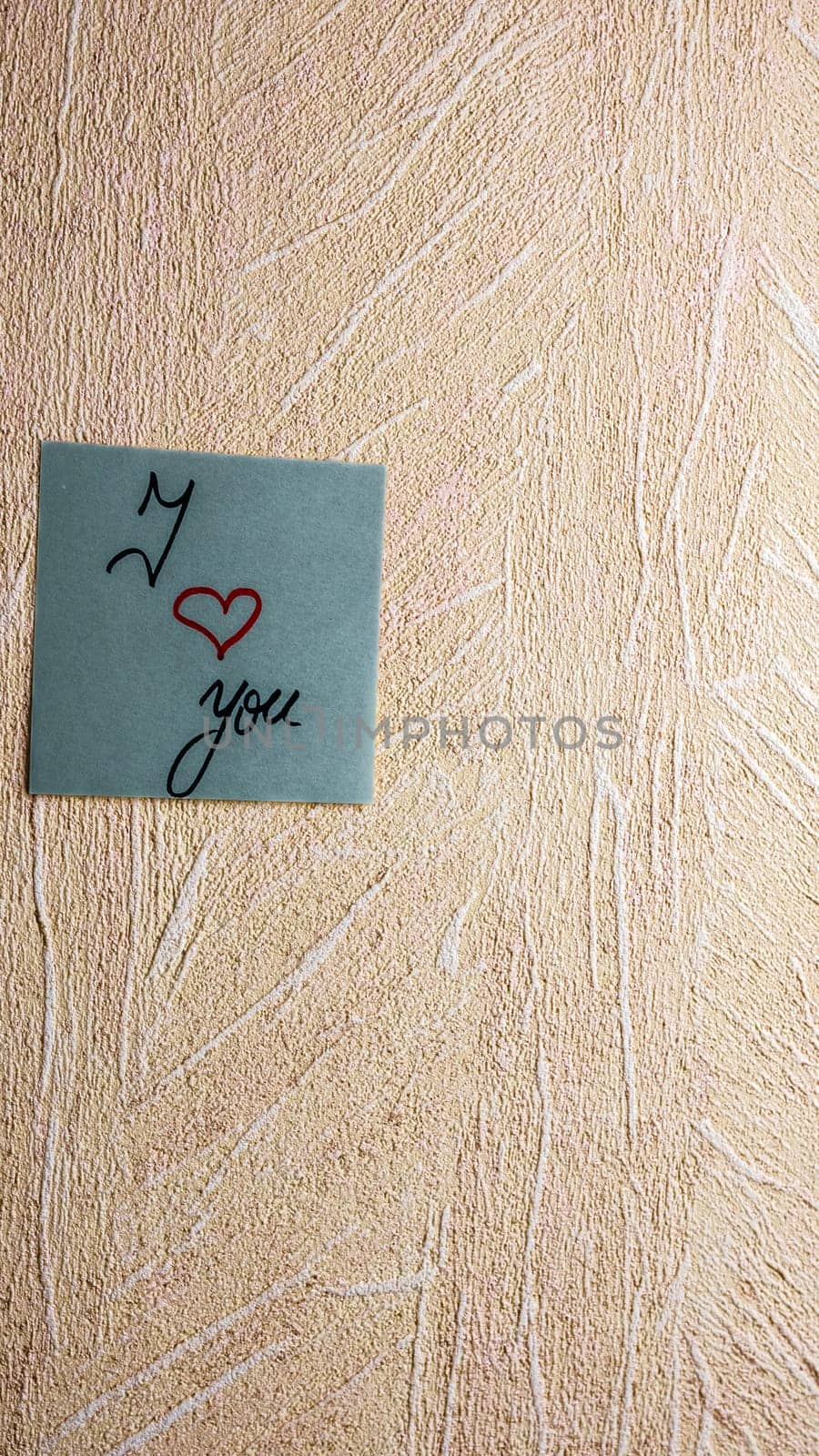 Text I love you on post it. Writing on colorful sticky note. Bucharest, Romania, 2020.