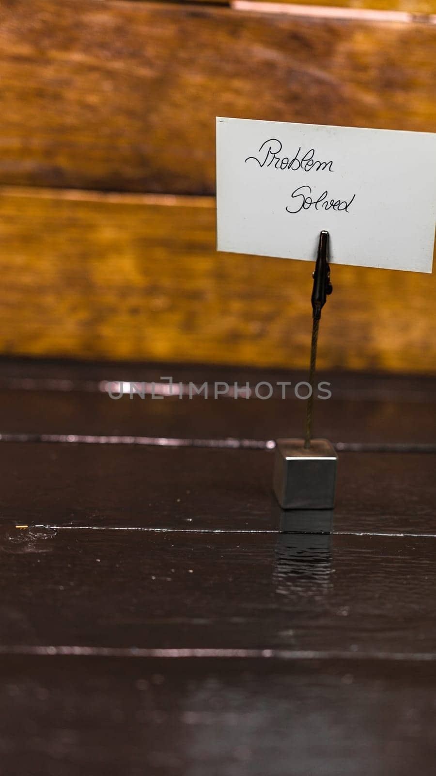 Square memo holder with memo post reminder. Writing problem solved on label. Bucharest, Romania, 2020.