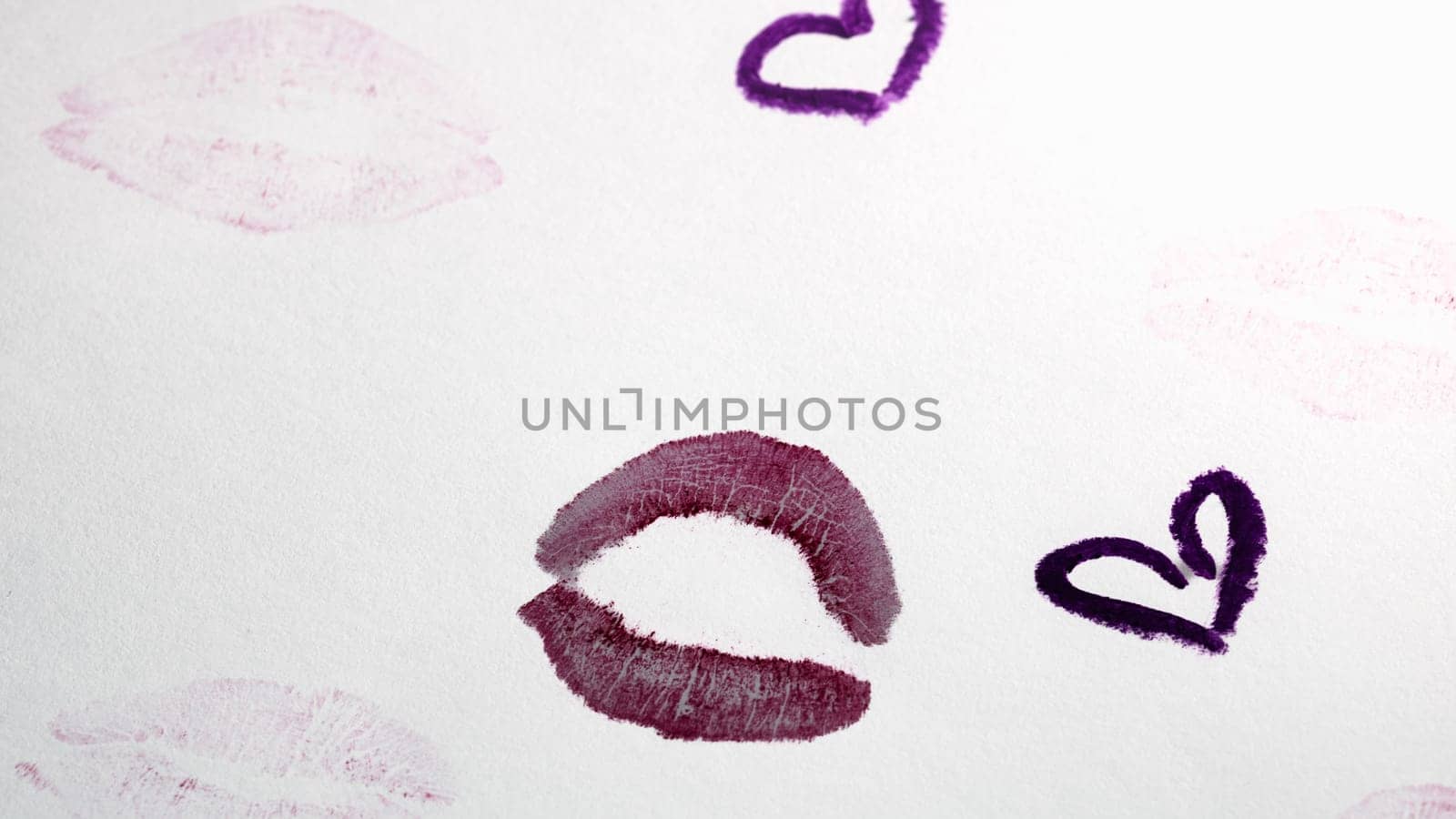 Valentine`s day concept. Lipstick kiss. Drawing with lipstick on paper. by vladispas