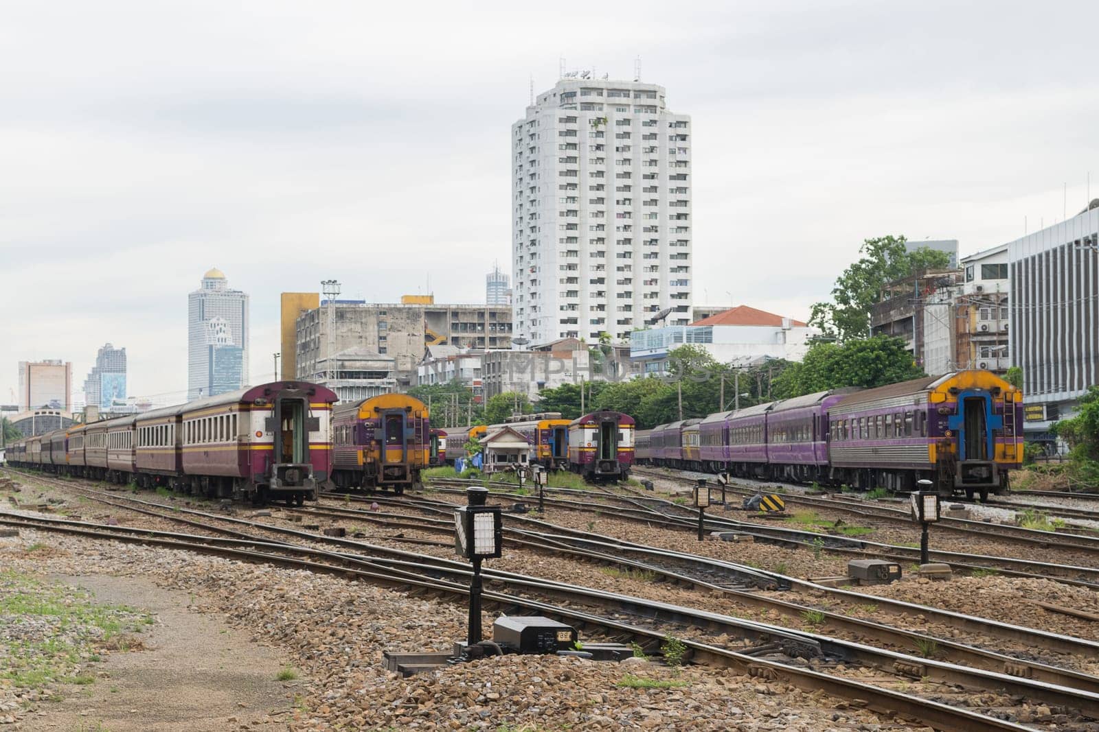 Railway train run on the railroad tracks. Many people in Thailand popular travel by train because it is cheaper.