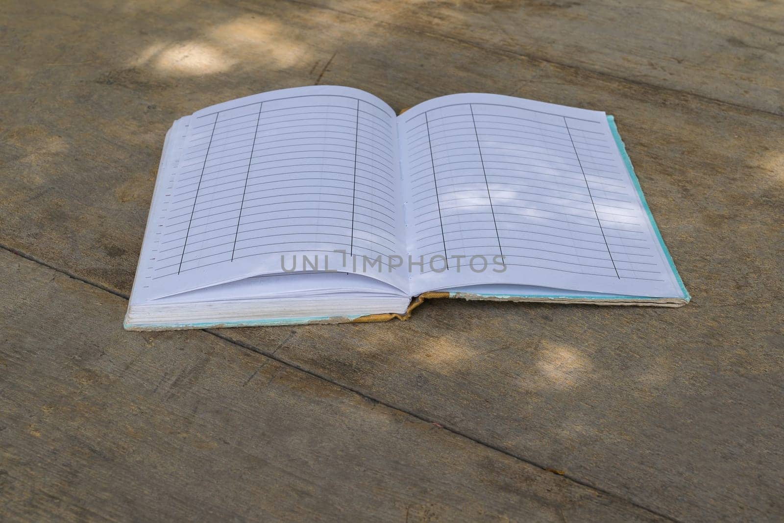 Vintage old Note book on a wood table