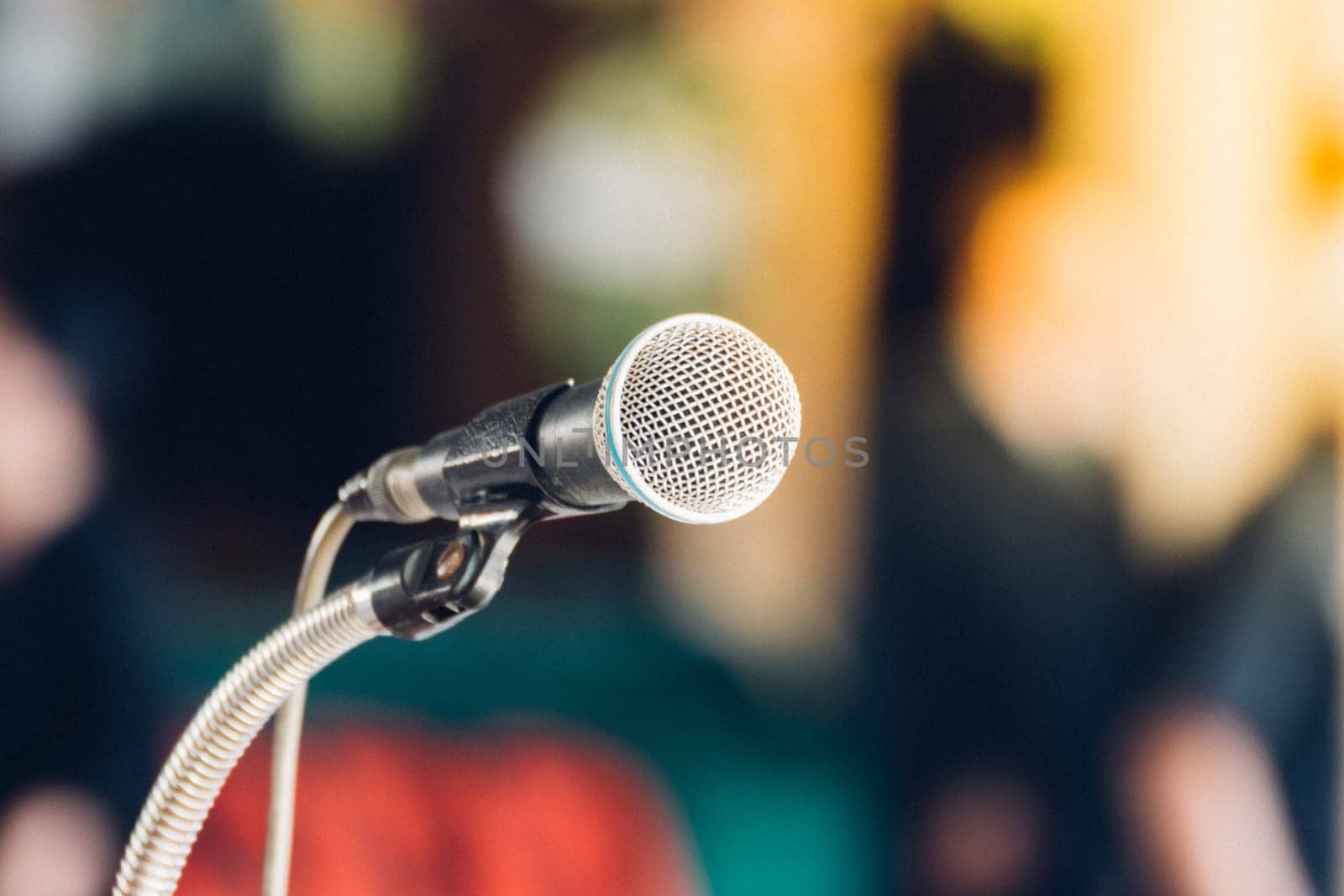 Microphone in seminar event or meeting room use mic for sound amplify when talk or communicate on stage defocus on meeting room background