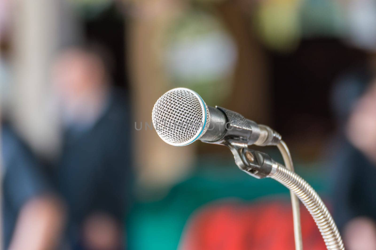 Microphone in seminar event or meeting room use mic for sound amplify when talk or communicate on stage defocus on meeting room background
