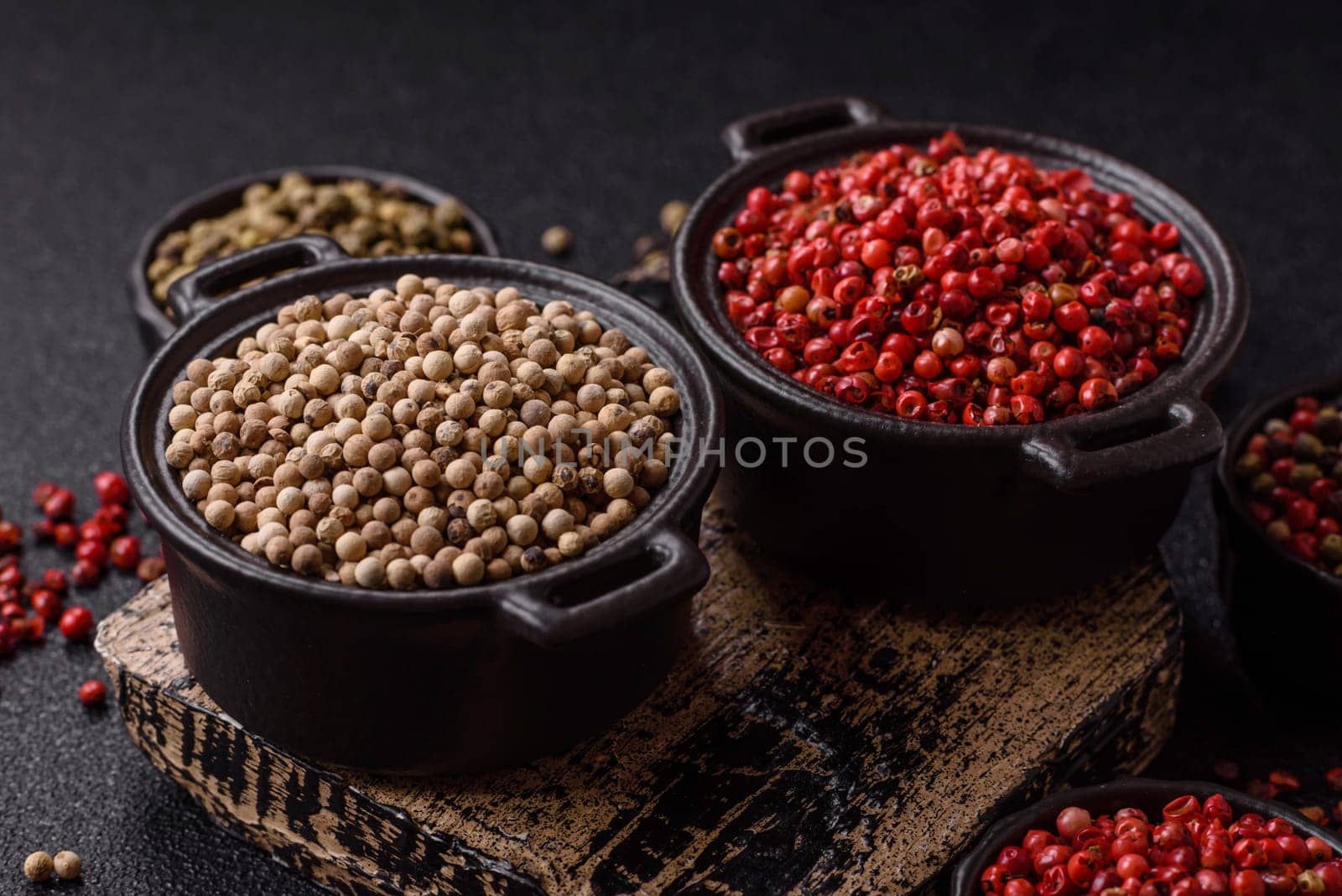 White allspice in a ceramic bowl on a dark concrete background