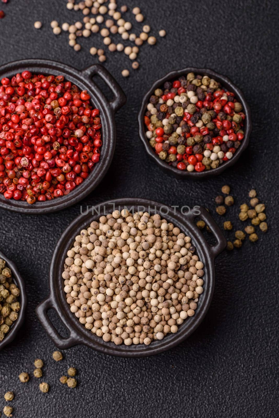 White allspice in a ceramic bowl on a dark concrete background