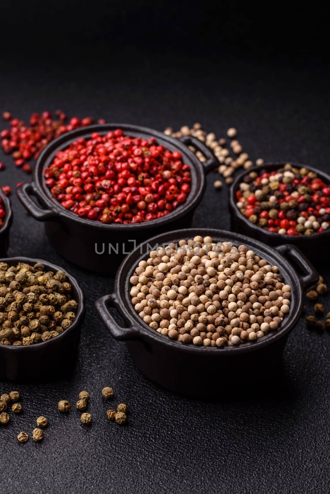 White allspice in a ceramic bowl on a dark concrete background
