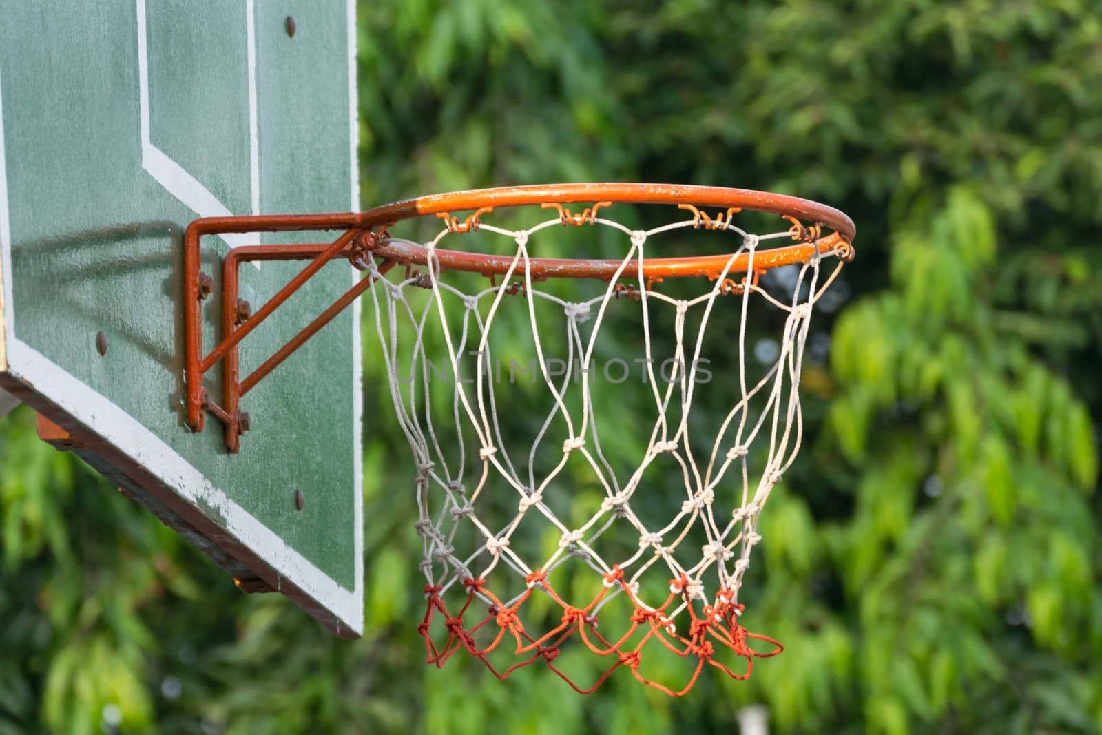 Basketball hoop make by wooden and ball in park