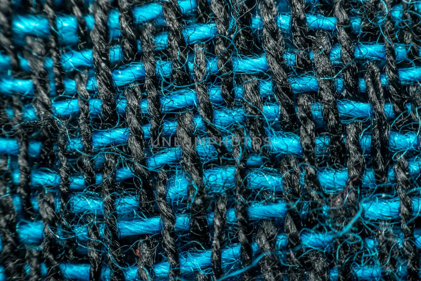 Macro of fabric weave texture surface blue, green and black color use for background