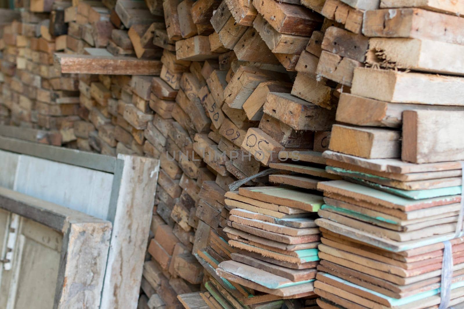 Slat and Timber wood from natural hardwood in warehouse for a construction