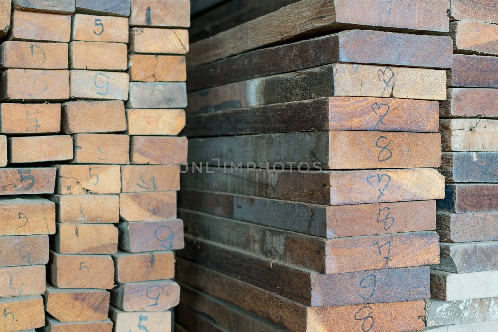 Slat and Timber wood from natural hardwood in warehouse for a construction
