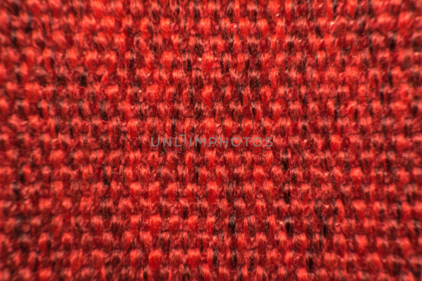 Macro of fabric weave texture surface red or pale orange color use for background