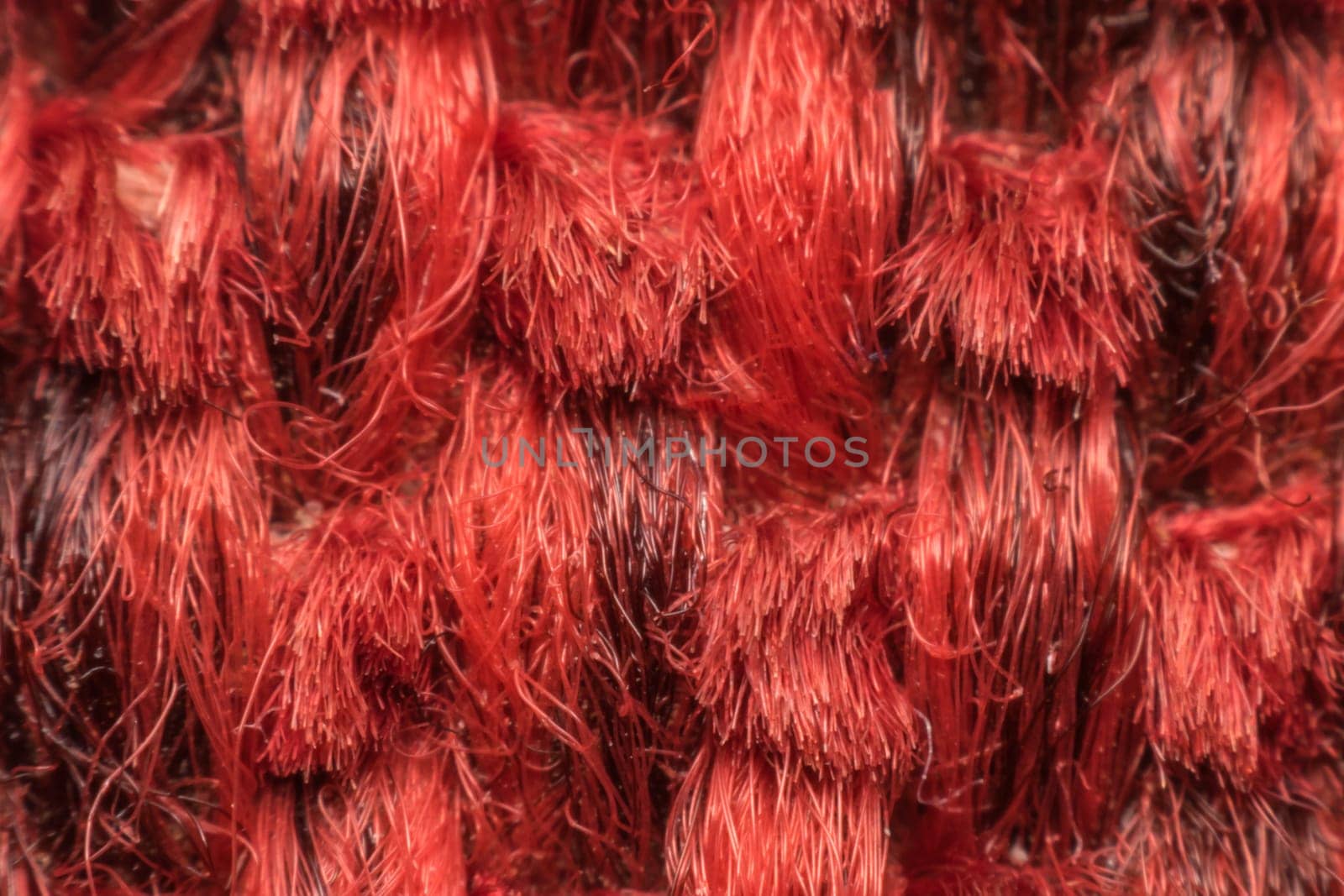 Macro of fabric weave texture surface red or pale orange color use for background