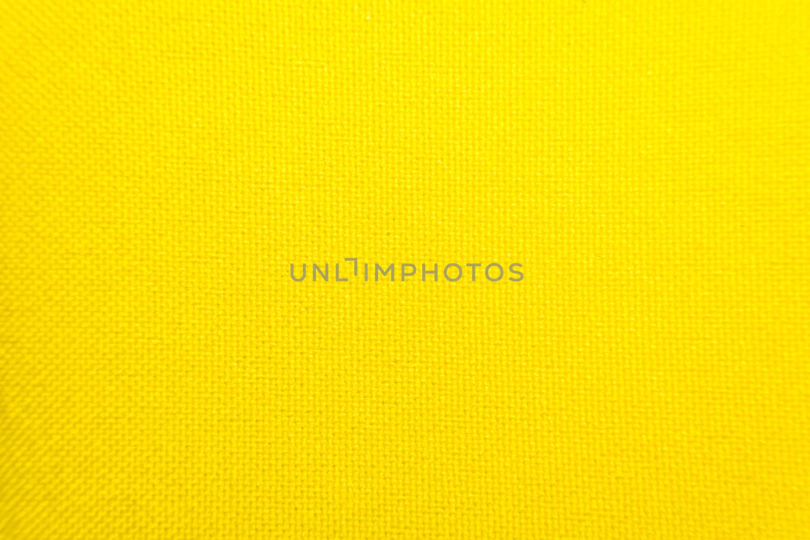 Macro of fabric weave texture surface yellow color use for background